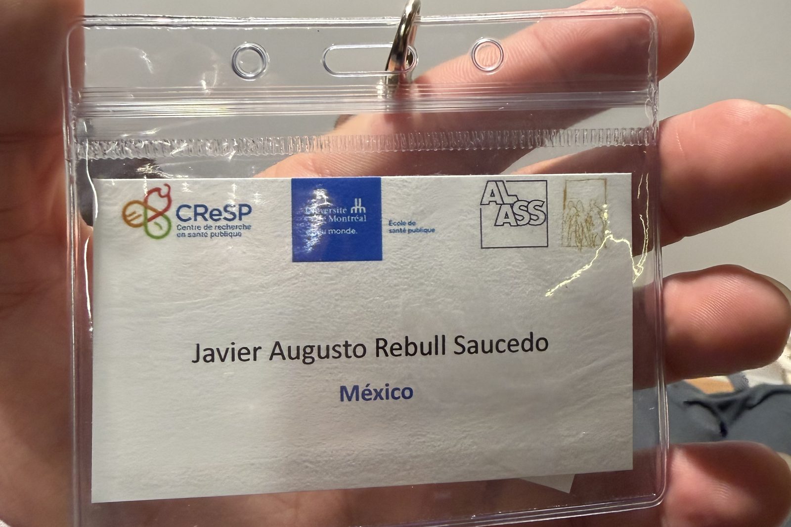 Gafete de participante del CALASS 2026 a nombre de Javier Augusto Rebull Saucedo, México, con los logotipos del CReSP, la École de santé publique de l’Université de Montréal y la ALASS.